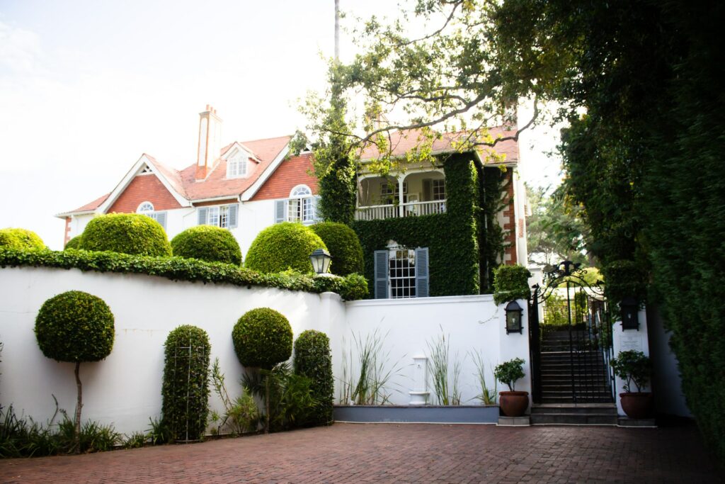 Main rehab clinic building with garden and shrubs